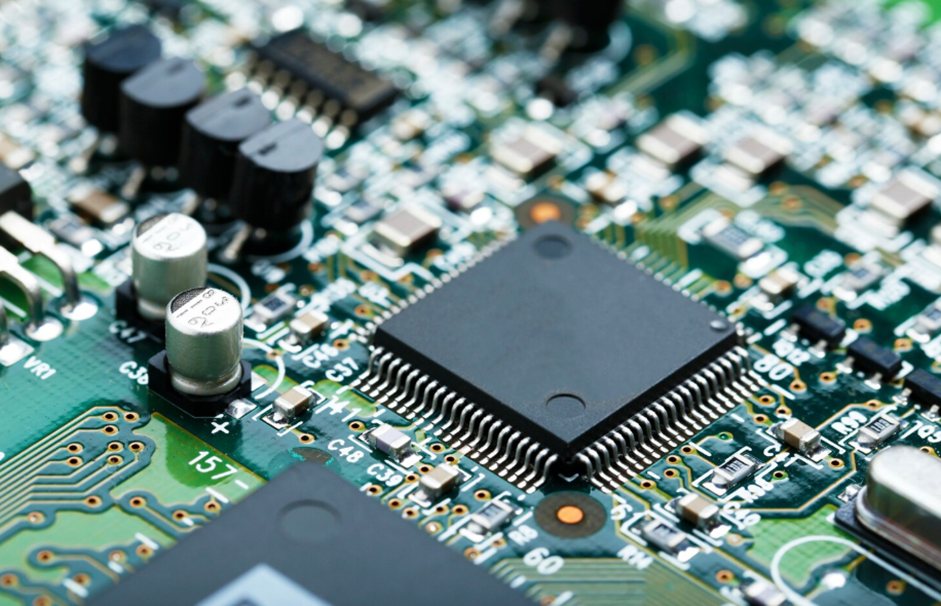 Close-up of green electronic circuit board with components.