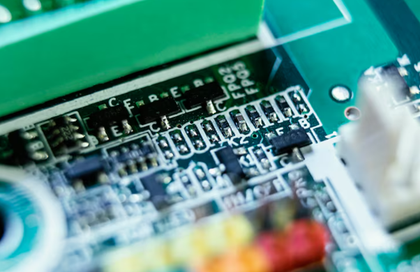 Close-up view of a green printed circuit board.